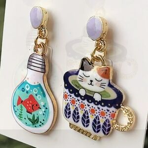 Enamel on gold tone fashion statement earrings.